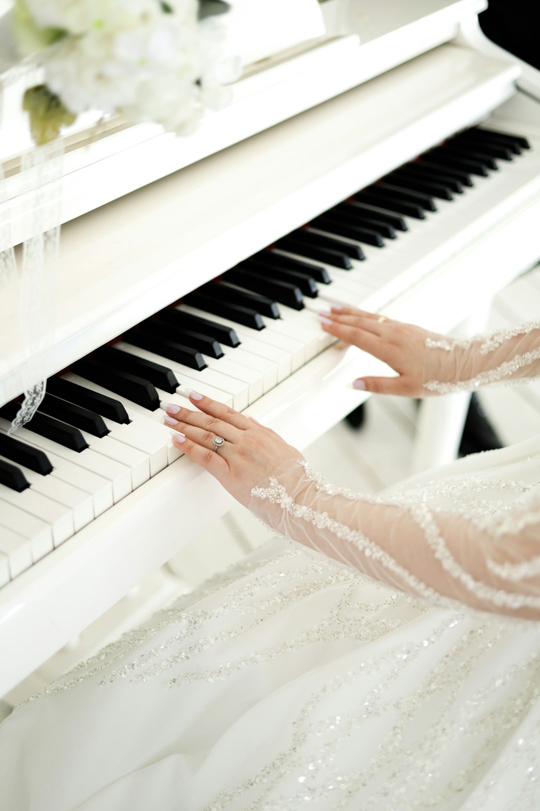 our-services-3 a-woman-in-a-wedding-dress-playing-a-piano-etajryc3one